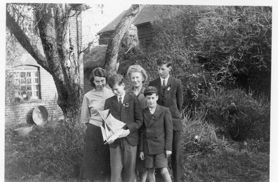 Derek with model yacht at Ivy Cottage, Great Sampford in 1950