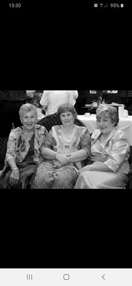 Mary catching up with her sisters in law at our wedding in 2011