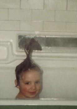 kit in the bath with silly hair