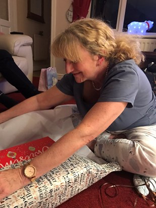 Mum opening her presents Christmas morning, her favourite time 🧡