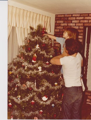 From the time Amanda was a baby you always lifted her up to put the top on the Christmas tree...