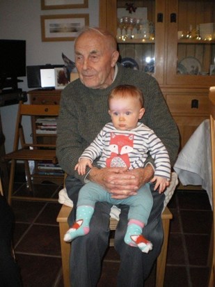 Holding his first great grand daughter