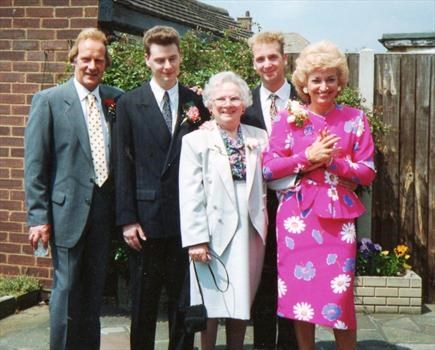 Pretty in pink, with her Mum, Tony and Boys