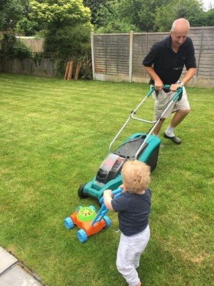 Showing Ethan how to handle a mower
