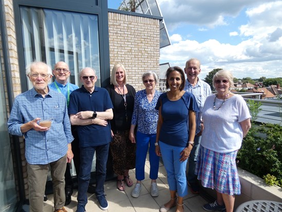 Serge with Richmond Charities residents staff and Munira Wilson MP on roof of new Wright's Almshouses