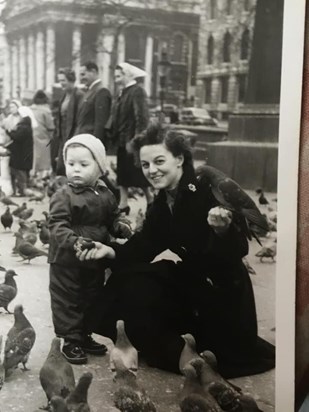 Peggy and Steve surrounded by pigeons
