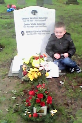 Frankie  laying flowers for there daddy's birthday 37th birthday