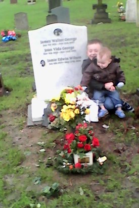 Frankie and Frazier laying flowers for there daddy's birthday 37th birthday