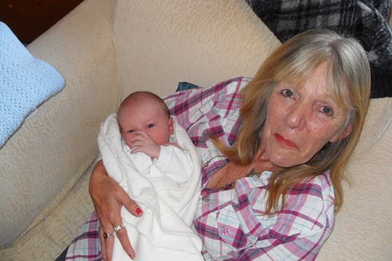 Loving Mum With first Grandchild