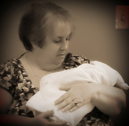 Grandma holding Mason the day he was born. July 27, 2012