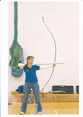 Shooting her long bow