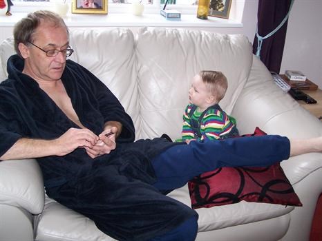 Oscar watching Grandad on his iPod