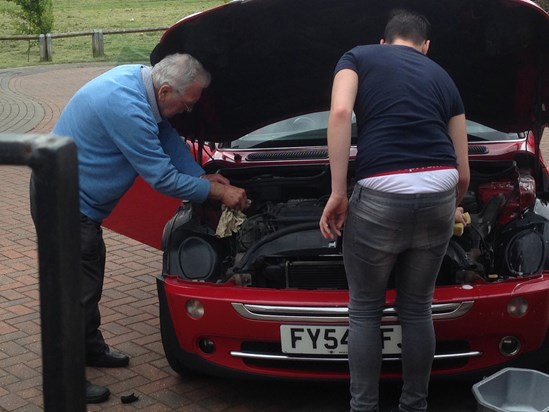 Tom and Grandad checking the new motor over