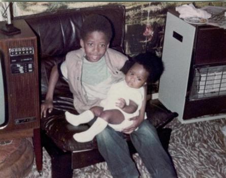 With his sister Efua as a baby
