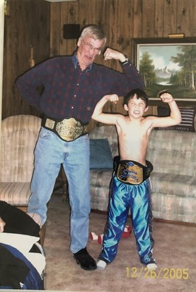Bruce and Clark Tolleson with toy WWE wrestling belts, Christmas 2005, Smith Center KS.