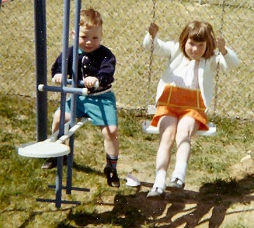 Rosemary and Gerry on Swing Set in Back Yard