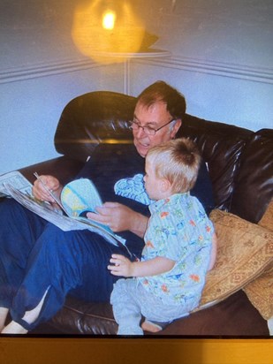 Pops and Toby e joying a book 