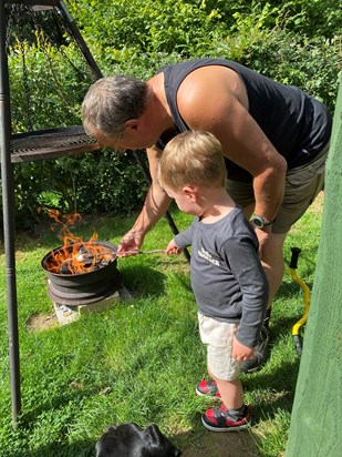 Toasting marshmallows on the fire with Grandpa 💙