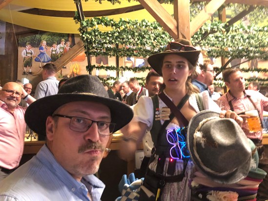 Jon buying his walking hat at Oktoberfest