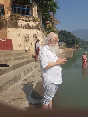 Giris praying in the river