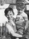 Dad on the left, holding one of his younger brothers, Ged