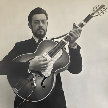 Another of dad as a young man with the guitar 