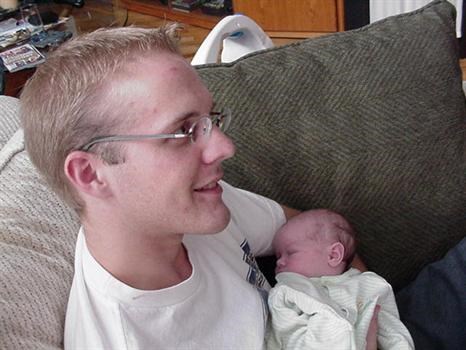 Sheldon holding Kat as a newborn - September 2005