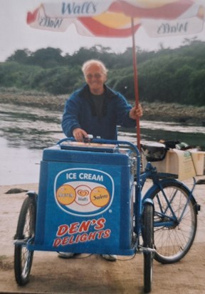 Dennis was amused to see his name on the front of this ice cream seller's cart.  