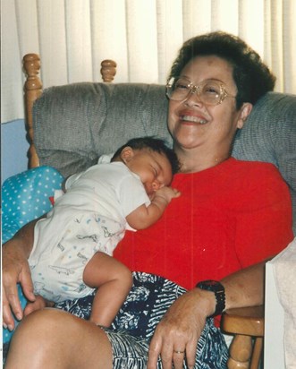 Grandma rocks with baby Christiana, just a few months old. Circa 1995