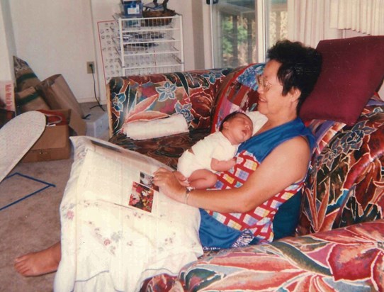 Baby Kayla naps while Granny reads - one of her favorite pastimes. Circa 1999.
