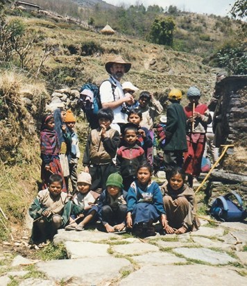 Nepal honey trek. Martin and local children, with the reed whistles he'd made for them - 1998