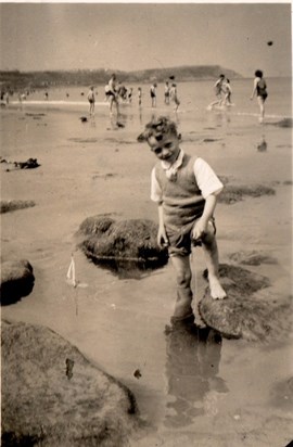 David on the beach, as a child
