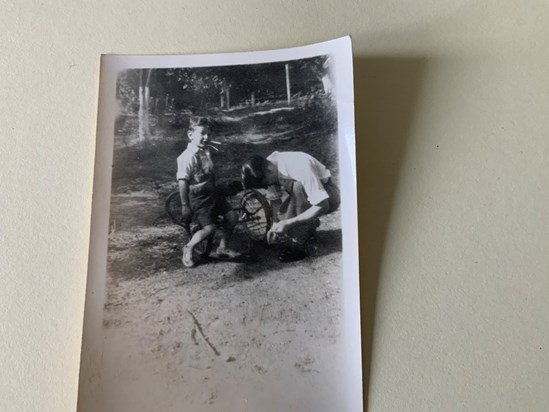 Tony and his dad fixing a bike