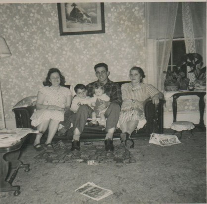 Joe with his mother, wife and two first kids