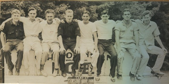 Joe (2nd from right) with other caddies(?)
