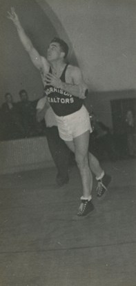 Shooting basketball (at old Geneva City Hall gym?)