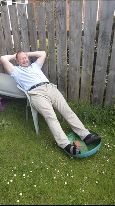 Michael relaxing in our old garden at The Wynd, 2019