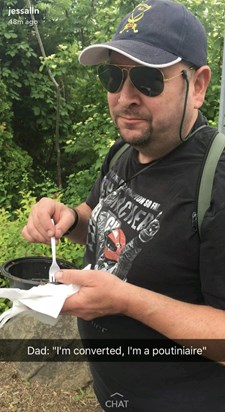 Michael, Circuit Gilles Villeneuve, Montreal GP, sampling the local cuisine, Poutine (Quebec French: a dish of french fries and cheese curds topped with gravy)