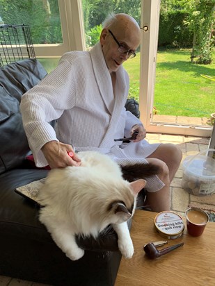 A favourite photo from June 2020.  John's not well, but happy in the sunshine of our last glorious summer together, with a pipe, his kindle, a coffee and one of our beloved cats.