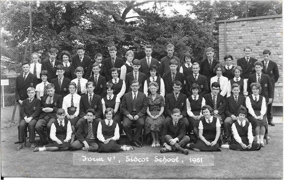 Upper Fifth 1961 - John and his classmates.  He's on the second row, next to the lady teacher.  You might struggle to spot him, as he has HAIR!!