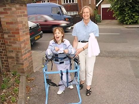 Moira walking outside with Mum 1998