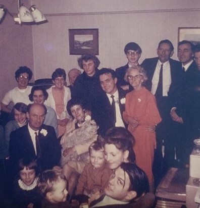 Aunty Marys wedding - my Dad bottom left and me with the white frilly collar