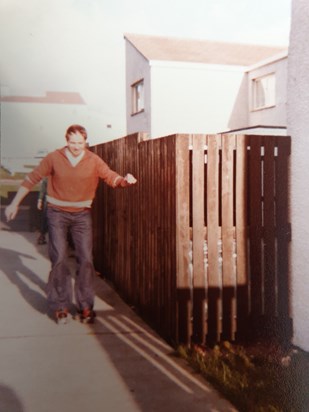 Roller skates, and flares and hair. That's my Dad.