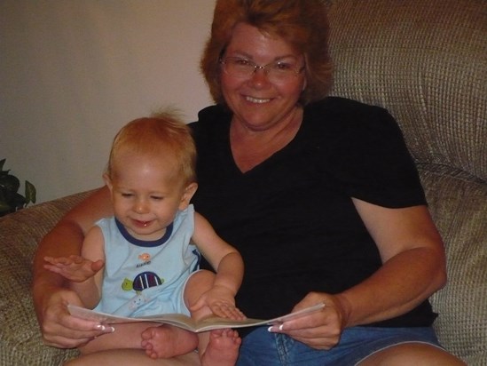 Grandma reading a book to baby Tyler