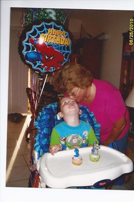 Grandma Kisses her Buzz lightyear on his 3rd Birthday