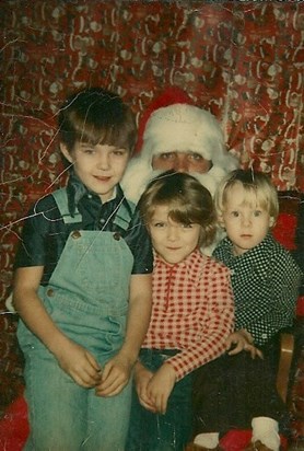Mark and Tracy and Bruce with santa