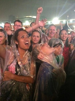 Watching Robbie Williams in the rain with the kids. Singapore F1