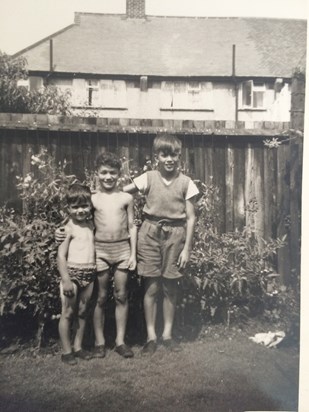 A young Ken with brothers Ray and David in their garden in whitefoot lane