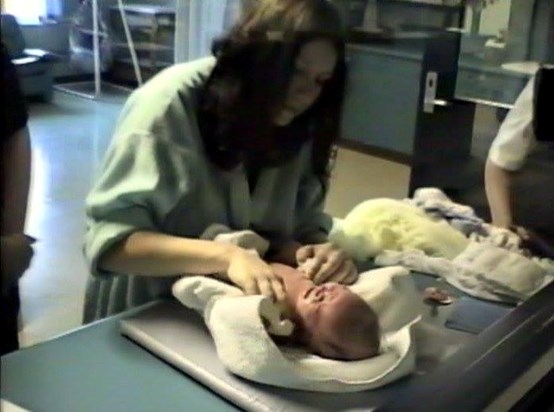 Kristy Lee Couzner with one of her newborn children