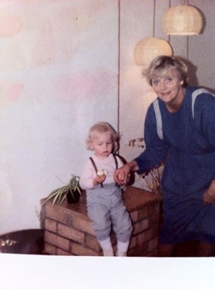 You and wee Aimee in your kitchen in Bearsden Road, God that fire place mum!